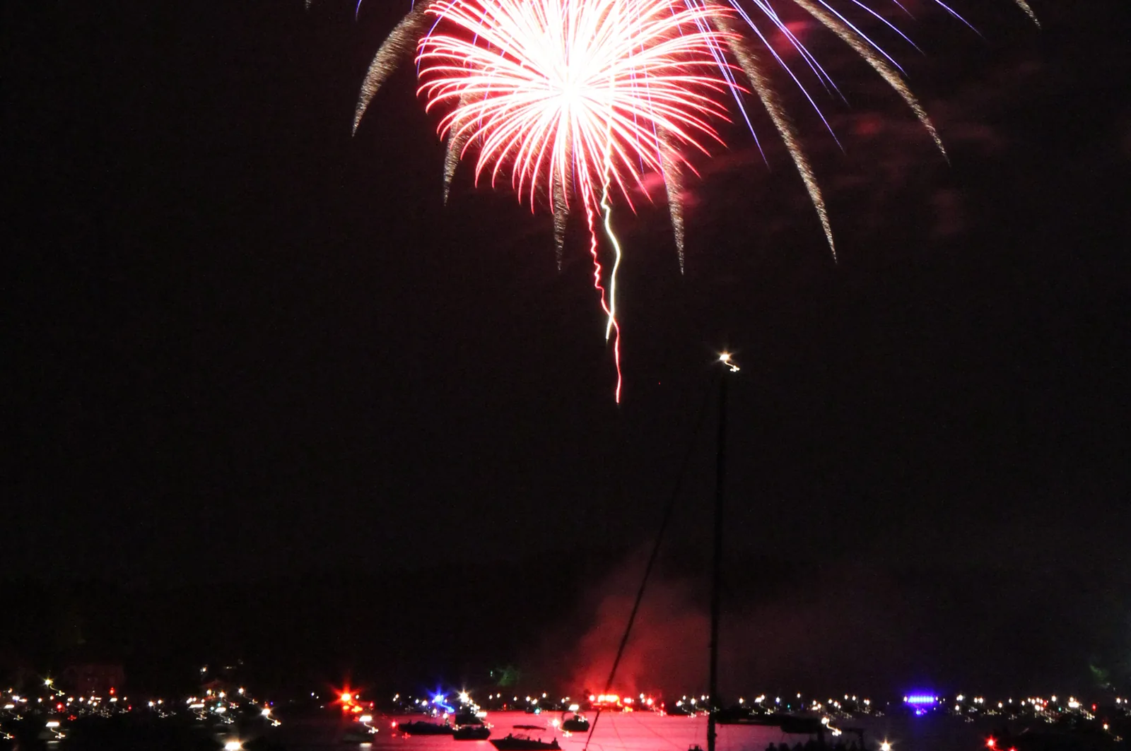 Fireworks burst over boats gathered on Lake Norman on the Fourth of July