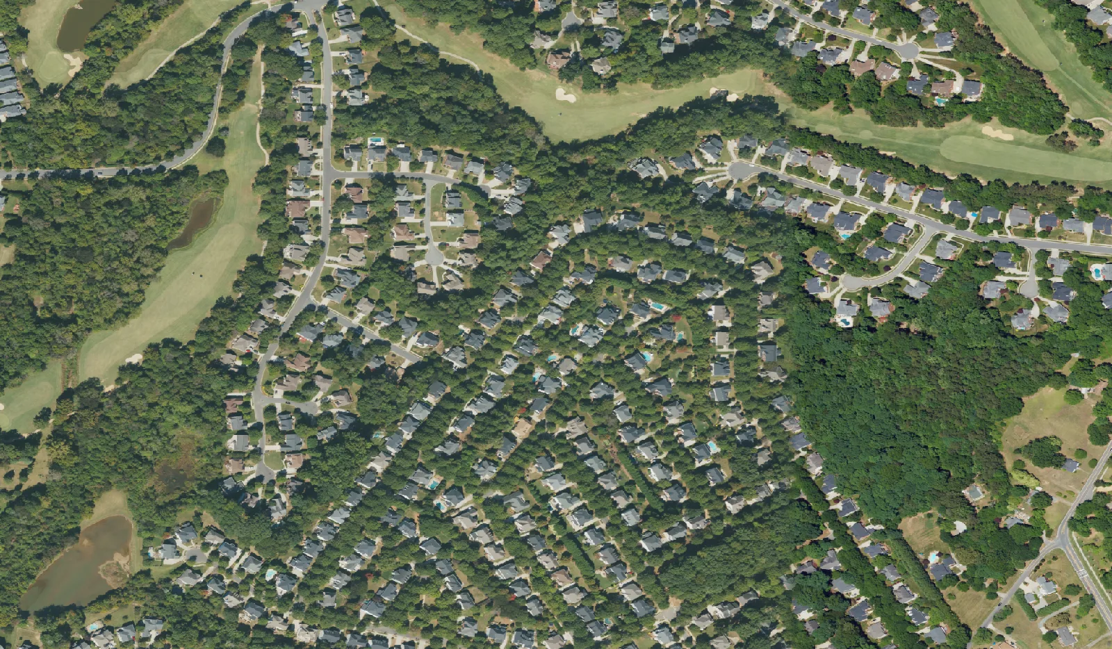 Homes and golf fairways in north Huntersville, seen from the air.
