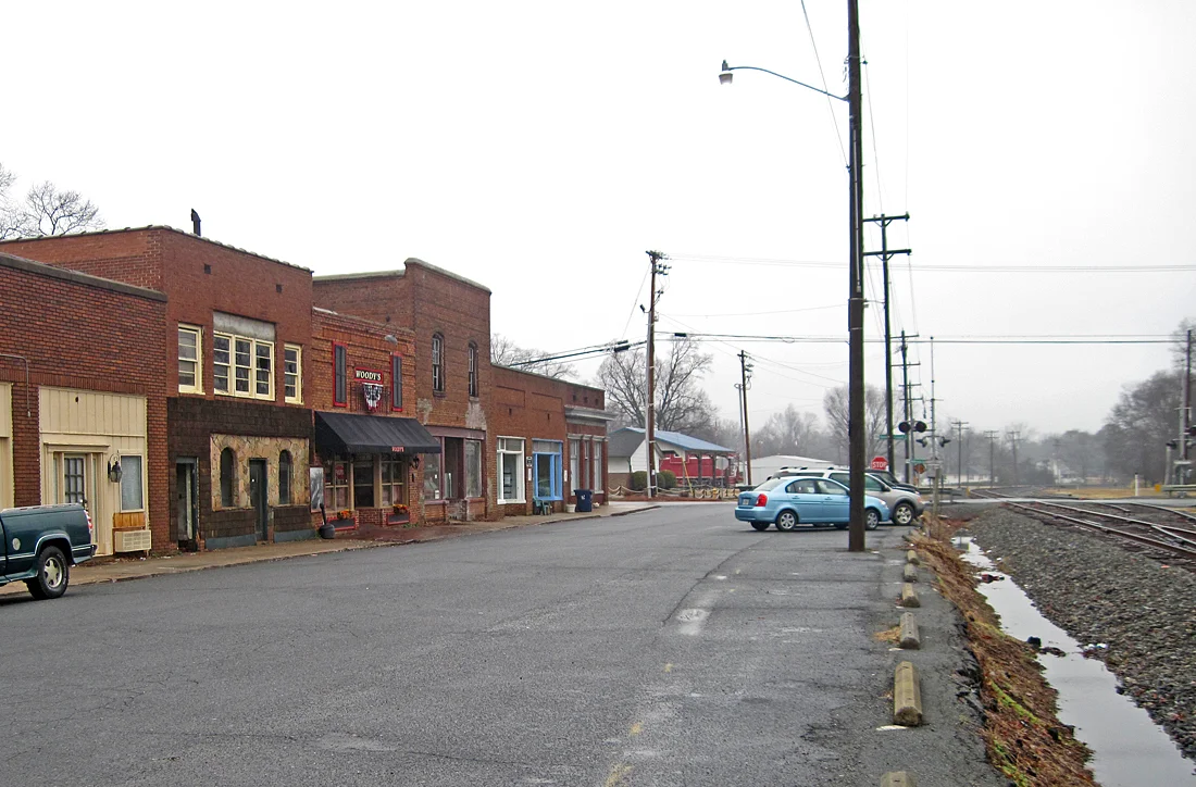 Storefronts beside the Norfolk Southern O-Line tracks in downtown Huntersville, the corridor the Red Line would use. The picture does not show downtown as it is today.