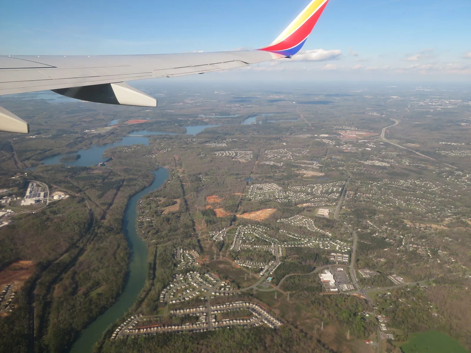 The Catawba River at Mount Holly, seen from an airliner window, with neighborhoods spreading out from its banks