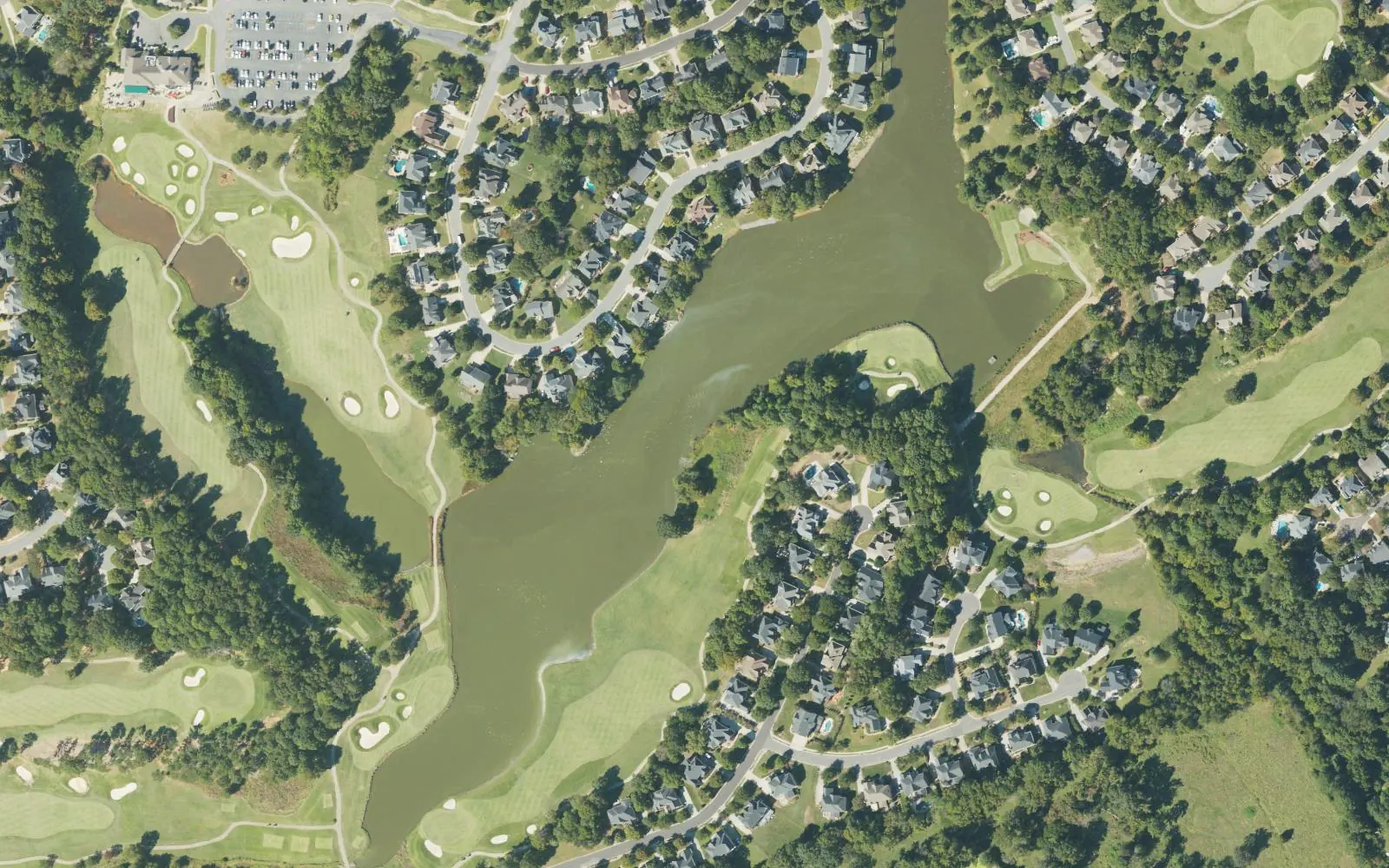 Homes around a golf course and lake north of Ramah Church Road in northeast Huntersville, seen from the air