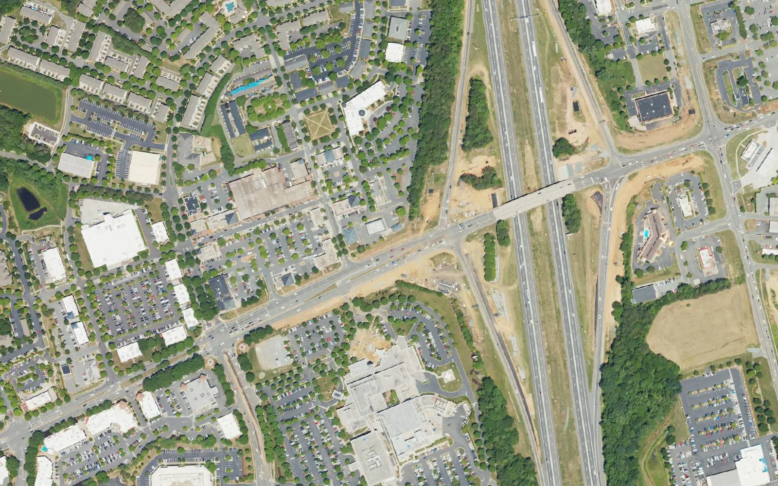 Interstate 77 at Exit 23, Gilead Road, in the middle of Huntersville, with the Rosedale shops at left, seen from the air