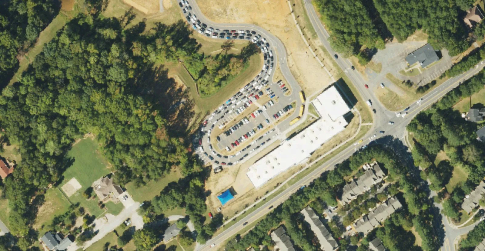 Bonnie Cone Classical Academy's building and car line off Asbury Chapel Road near Huntersville, seen from the air