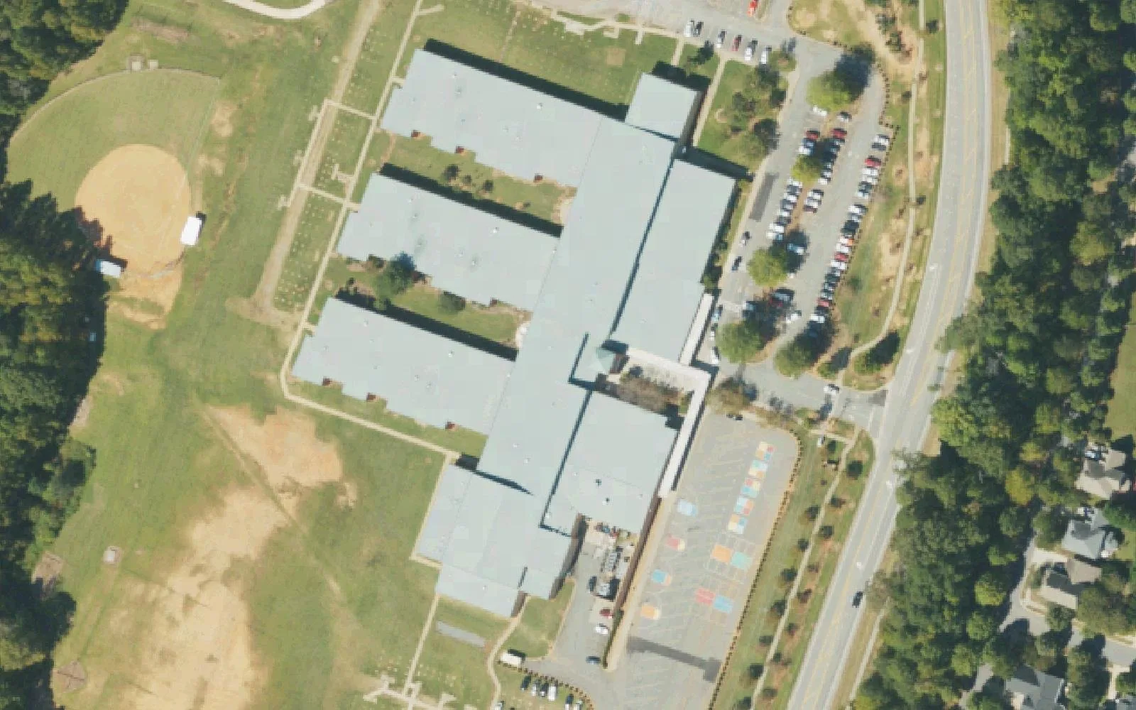 Francis Bradley Middle School's classroom wings and ballfield beside Beatties Ford Road in west Huntersville, seen from the air