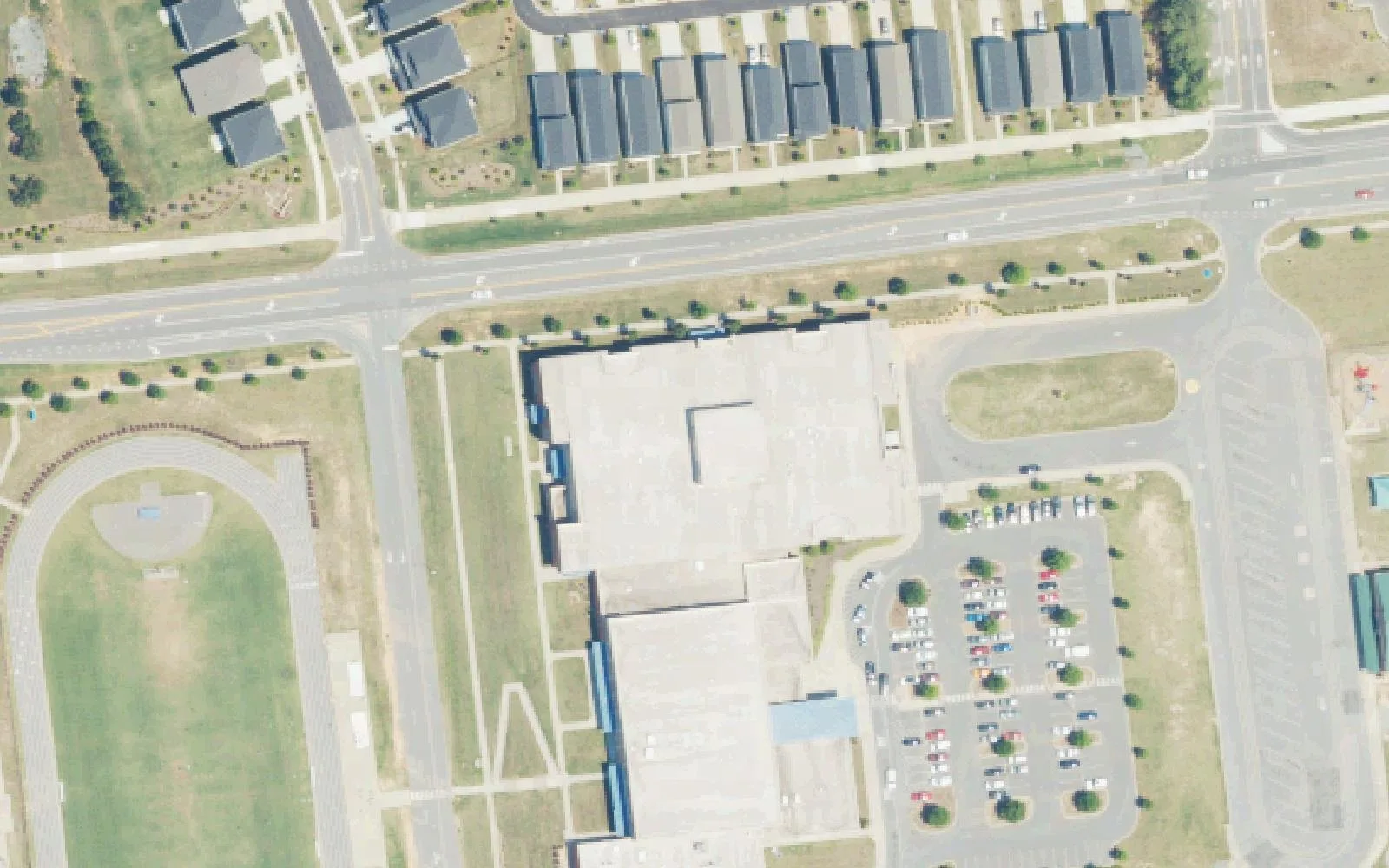 J.M. Alexander Middle School's building, parking lot and track beside Hambright Road in south Huntersville, seen from the air