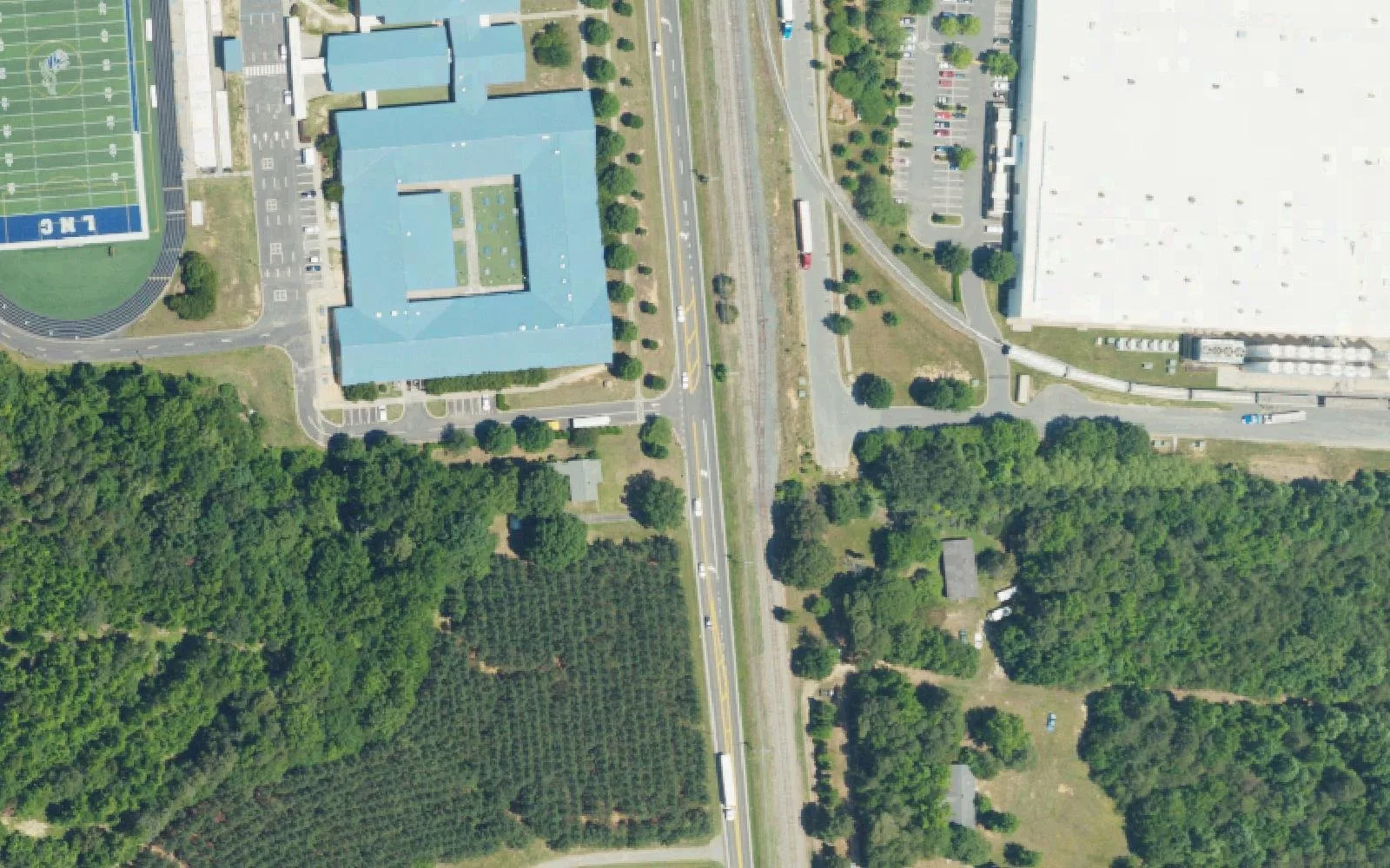 Lake Norman Charter's middle school building and Knights Field beside Old Statesville Road in Huntersville, seen from the air