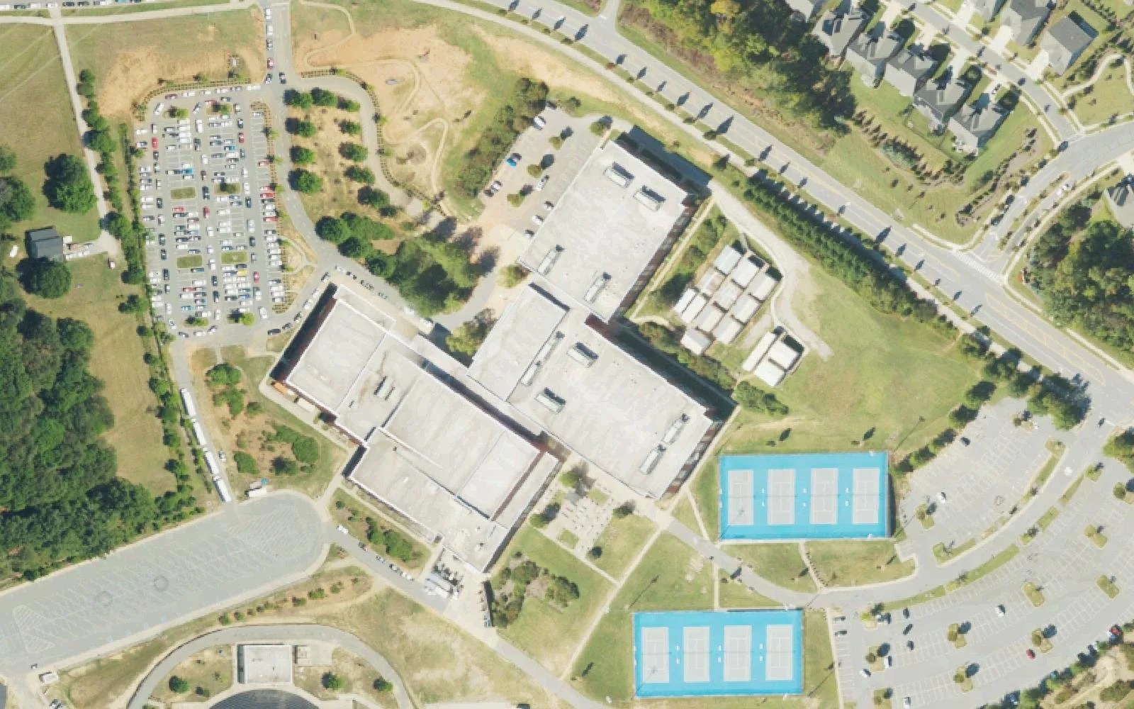 William Amos Hough High School's main building, parking lots and tennis courts off Bailey Road in Cornelius, seen from the air