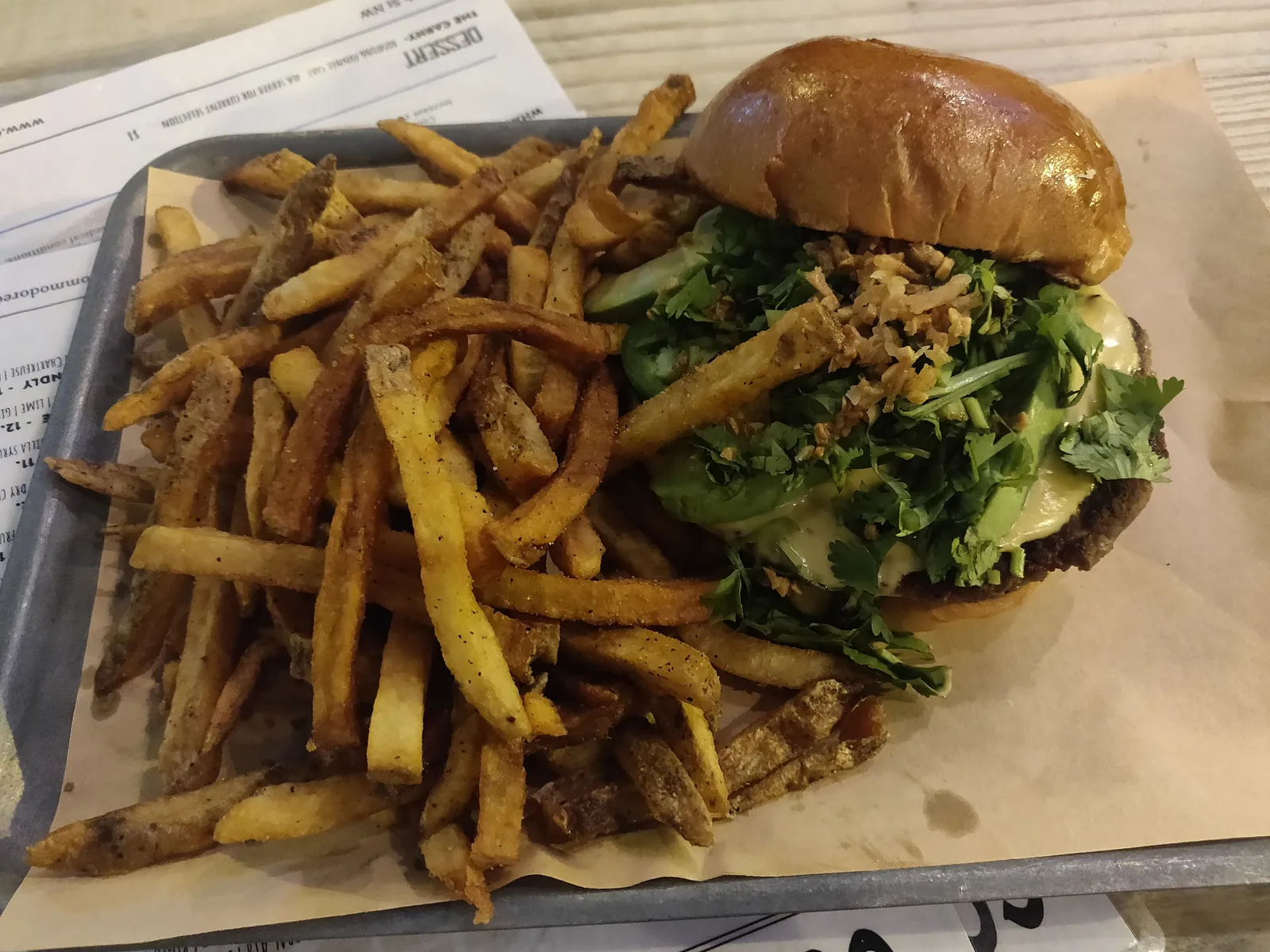 A cheeseburger and fries on a tray; the photo does not show a Huntersville restaurant.