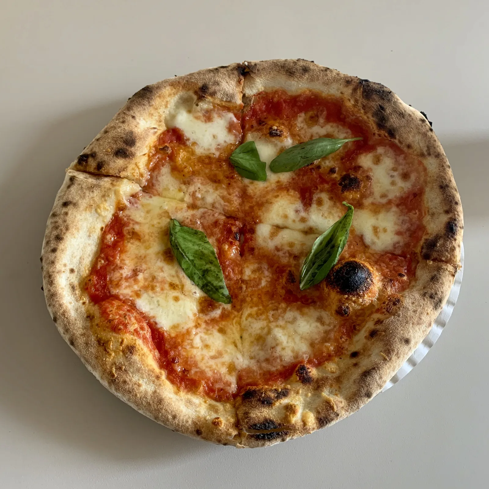 A Neapolitan pizza at Trappica in Ljubljana, Slovenia; the photo does not show a Huntersville restaurant.